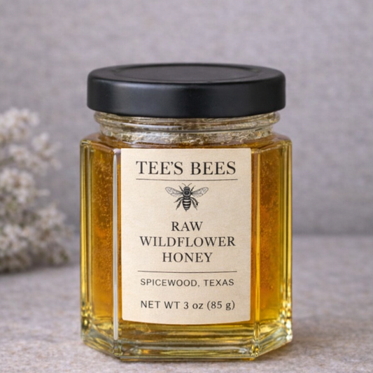 Jar of Tee's Bees raw wildflower honey on a neutral background