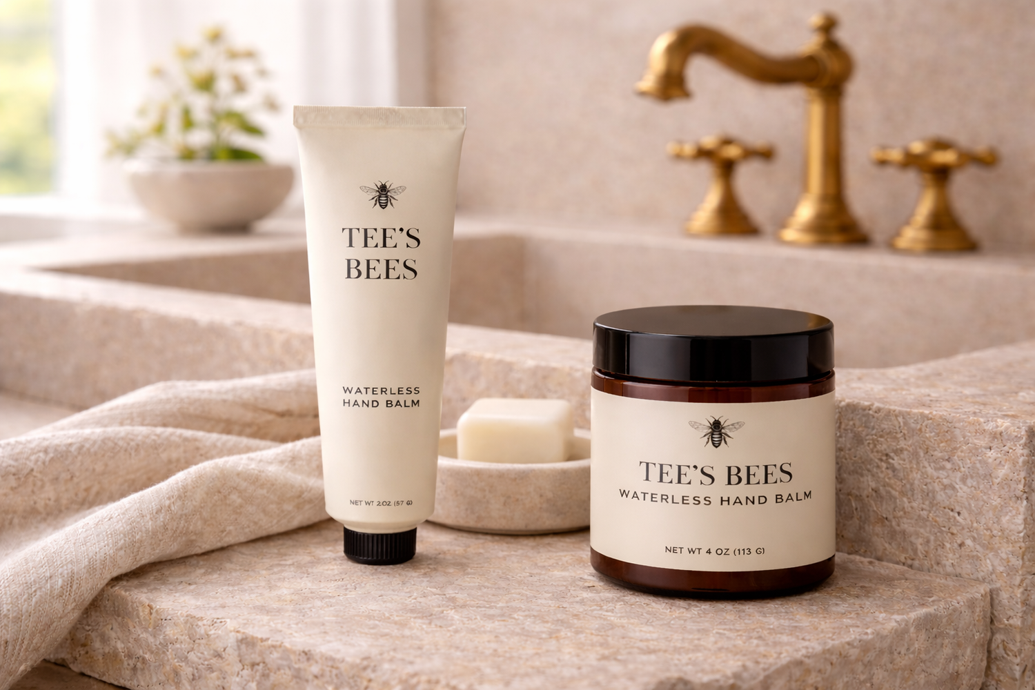 Tee's Bees hand balm products on a bathroom counter with a sink in the background.